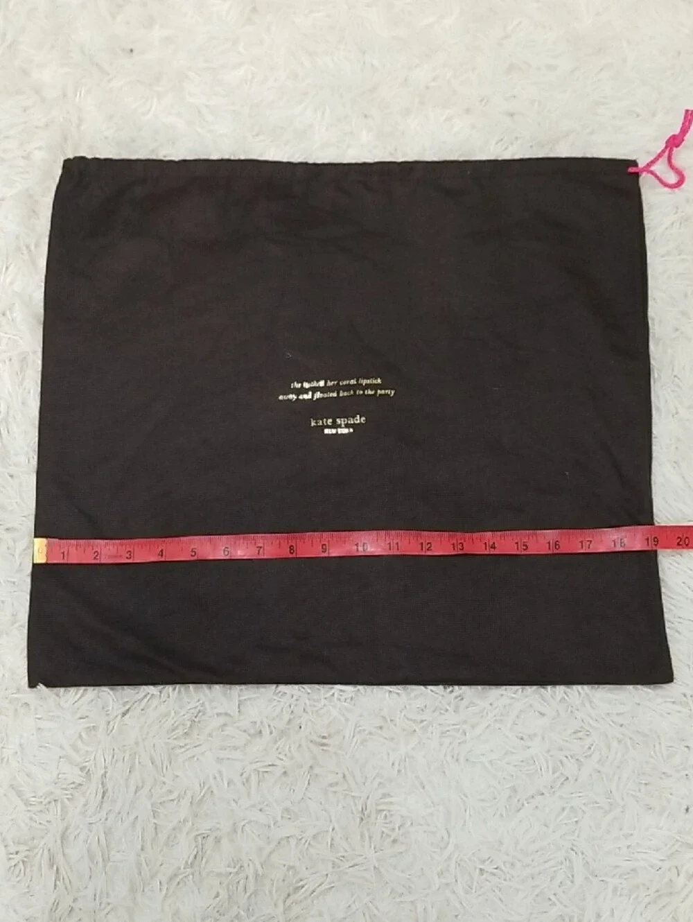 kate spade black dust bag with pink drawstring and gold logo